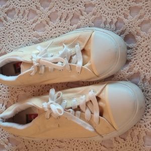 Pale yellow Nike ladies tennis shoes size 8